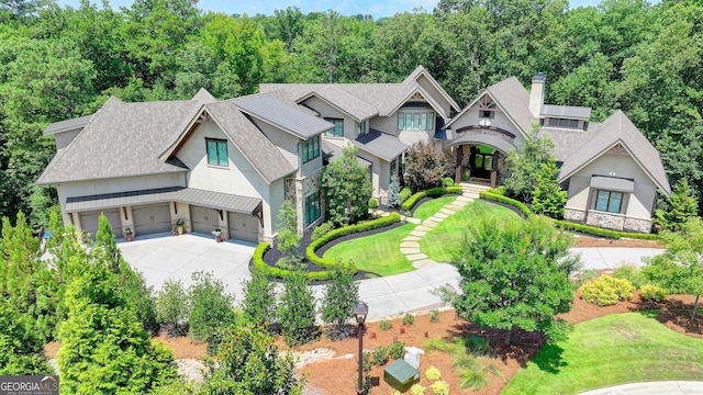 962 Chattooga Trce, Suwanee, GA 30024 - view of front of home featuring stone siding, concrete driveway, a shingled roof, a chimney, and board and batten siding