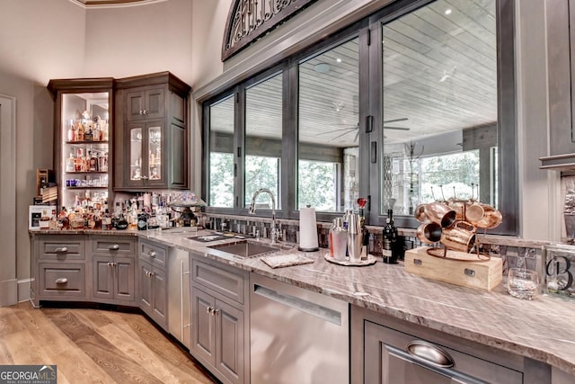 962 Chattooga Trce, Suwanee, GA 30024 - indoor bar with dishwasher, light wood finished floors, healthy amount of natural light, and ornamental molding