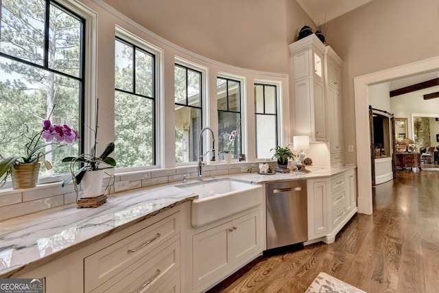962 Chattooga Trce, Suwanee, GA 30024 - kitchen with dishwasher, light wood-style flooring, white cabinetry, and light stone countertops