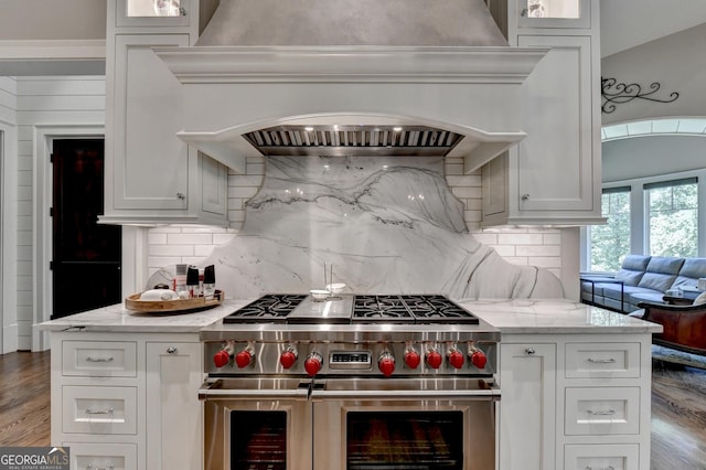 962 Chattooga Trce, Suwanee, GA 30024 - kitchen featuring double oven range, custom range hood, wood finished floors, and light stone countertops