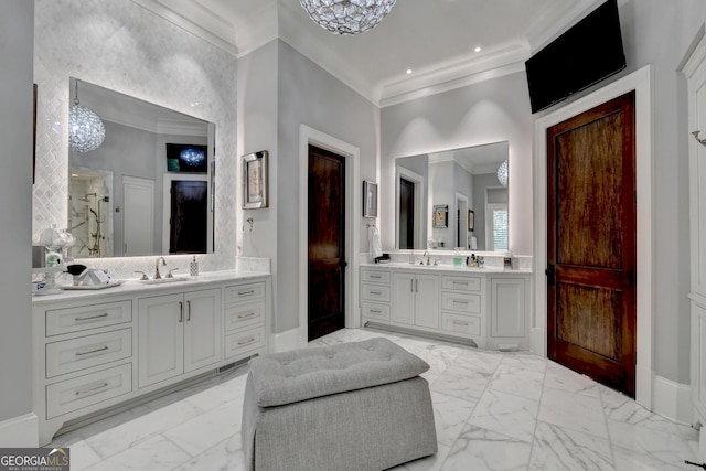 962 Chattooga Trce, Suwanee, GA 30024 - bathroom with ornamental molding, marble look tile flooring, two vanities, and a chandelier