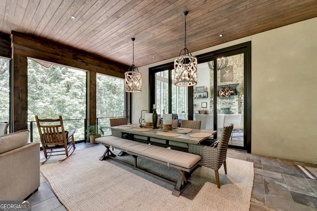 962 Chattooga Trce, Suwanee, GA 30024 - dining area featuring wooden ceiling, a chandelier, and stone tile flooring