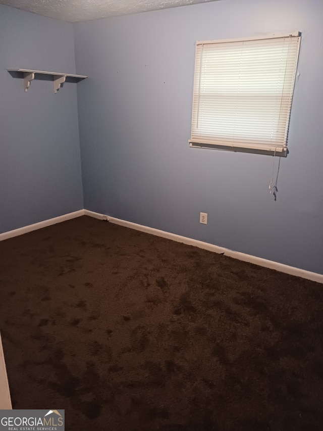 empty room featuring carpet flooring