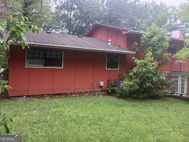 view of property exterior featuring a yard