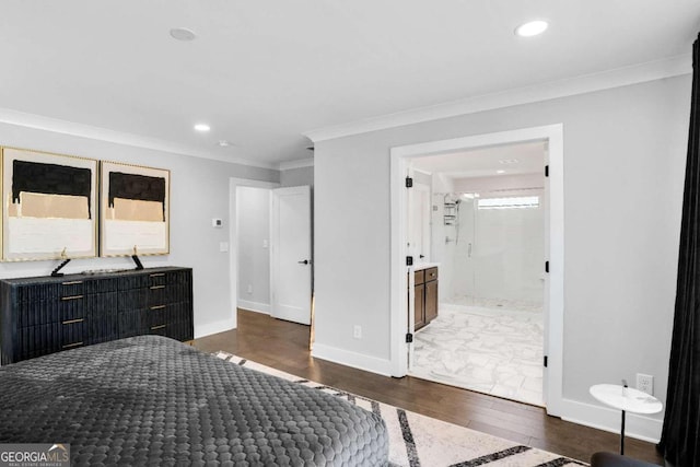 bedroom featuring ensuite bath, crown molding, and dark hardwood / wood-style floors