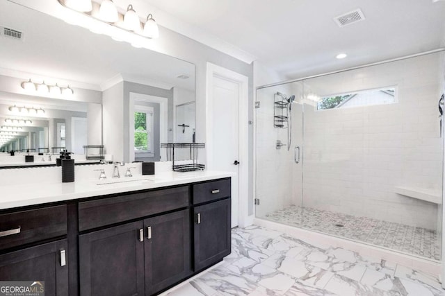 bathroom with tile patterned floors, crown molding, vanity, and an enclosed shower