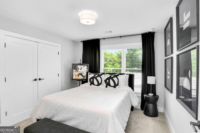 carpeted bedroom featuring a closet