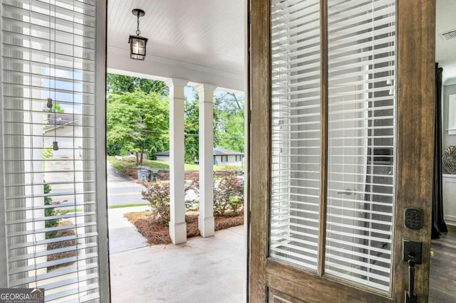 doorway to outside featuring concrete floors