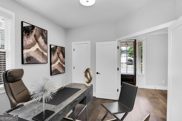 office with dark wood-type flooring