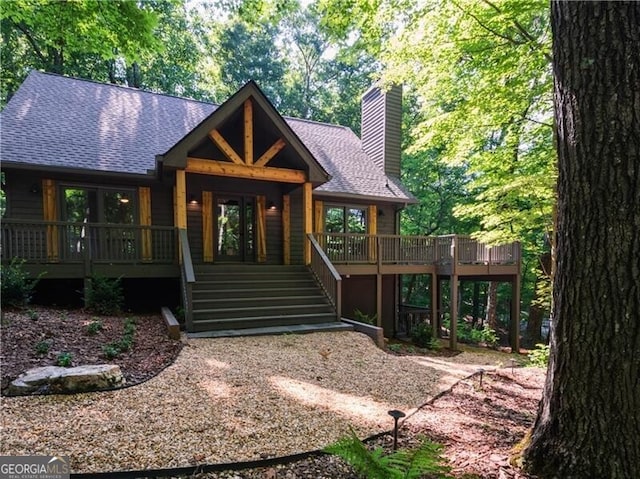 view of front of property with a wooden deck