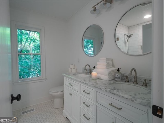 bathroom featuring tile patterned floors, vanity, and toilet