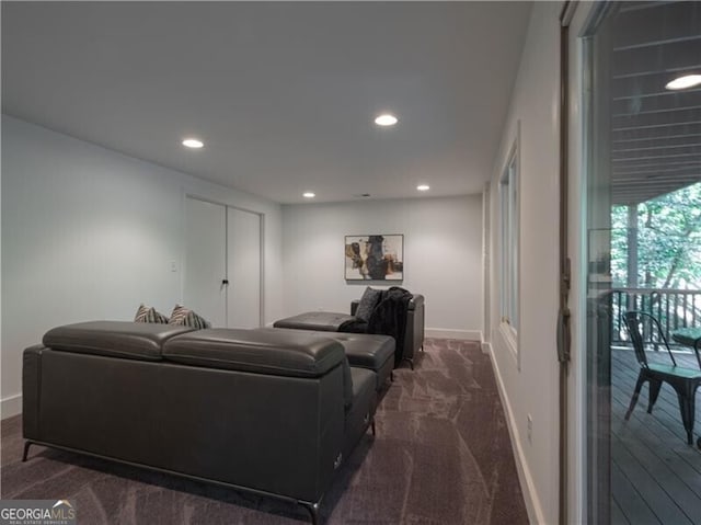 living room featuring dark colored carpet