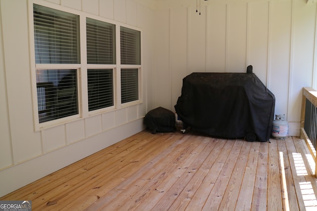 wooden terrace featuring a grill