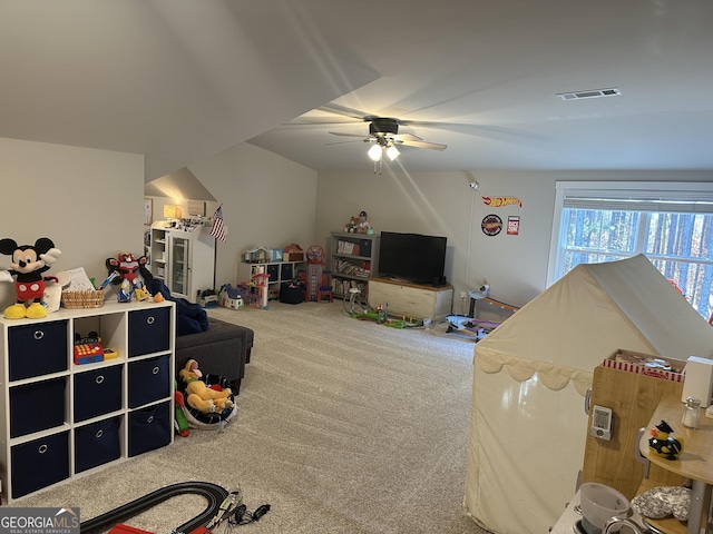 playroom featuring a ceiling fan, visible vents, and carpet flooring