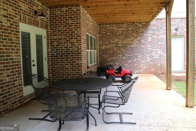 view of patio featuring outdoor dining area