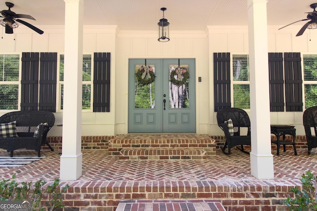 property entrance featuring french doors and a ceiling fan