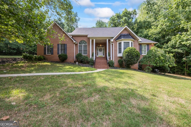 view of front facade featuring a front lawn and brick siding