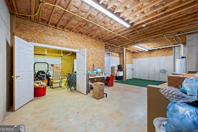 unfinished basement featuring gas water heater