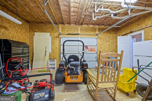 garage with freestanding refrigerator