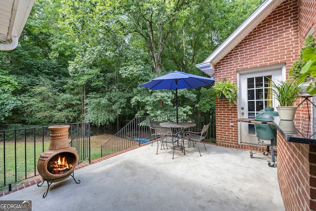 view of patio / terrace featuring grilling area, fence, and outdoor dining area