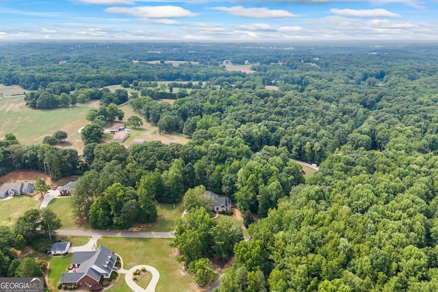 aerial view featuring a view of trees