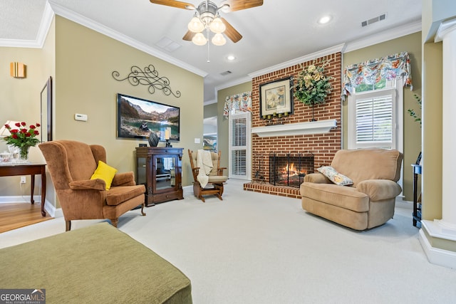 living area featuring visible vents, baseboards, ornamental molding, a brick fireplace, and carpet