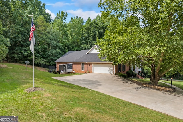 view of front of home with a front lawn, concrete driveway, brick siding, and an attached garage