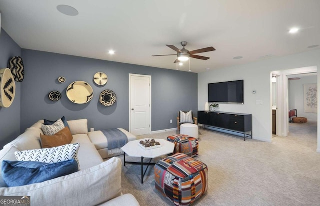 living room featuring ceiling fan and carpet flooring