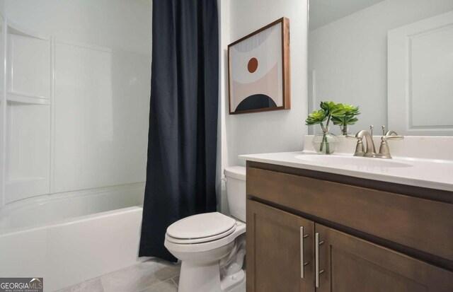 full bathroom featuring vanity, shower / bath combination with curtain, tile patterned floors, and toilet