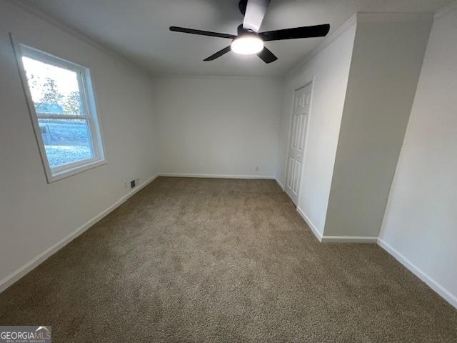 unfurnished bedroom with light carpet and ceiling fan