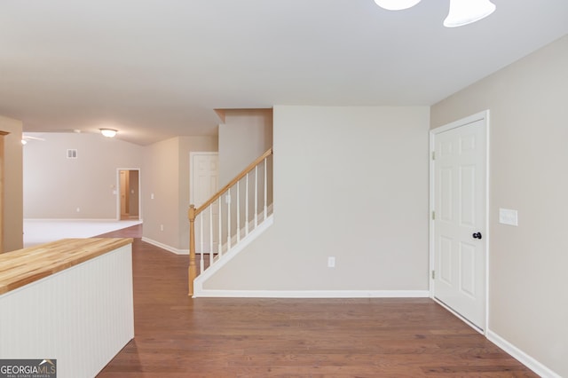 spare room with dark wood-type flooring