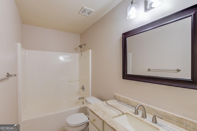 full bathroom featuring vanity, washtub / shower combination, and toilet