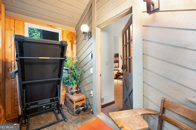 interior space featuring wood walls