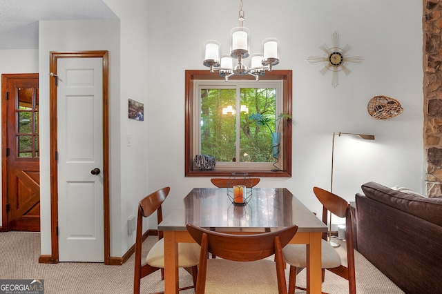 carpeted dining space with an inviting chandelier