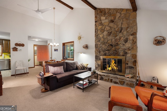 carpeted living room featuring ceiling fan with notable chandelier, beam ceiling, a stone fireplace, and high vaulted ceiling