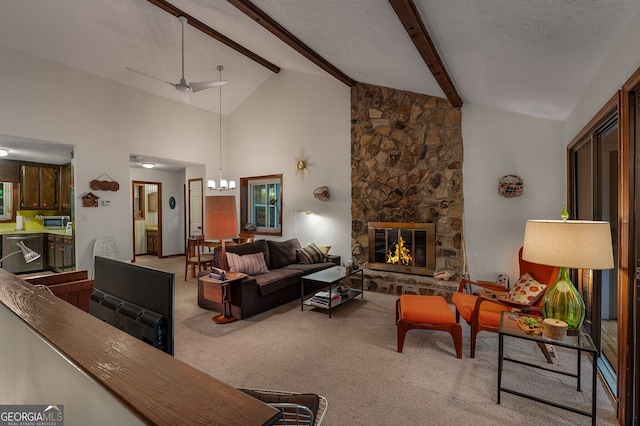 carpeted living room featuring beamed ceiling, a fireplace, ceiling fan with notable chandelier, and high vaulted ceiling