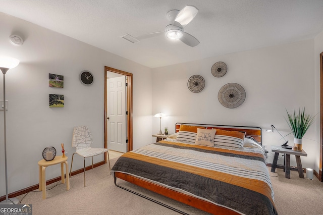 bedroom with light colored carpet and ceiling fan