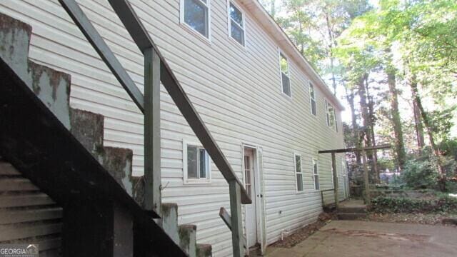 view of property exterior featuring a patio area