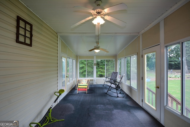 sunroom / solarium featuring ceiling fan and plenty of natural light