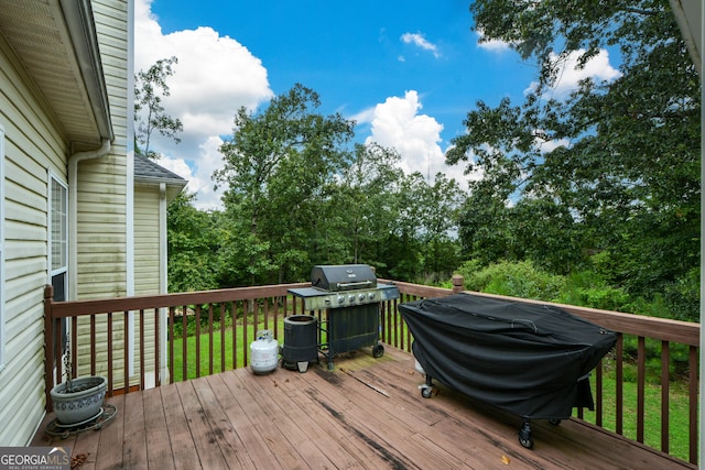 wooden deck with grilling area