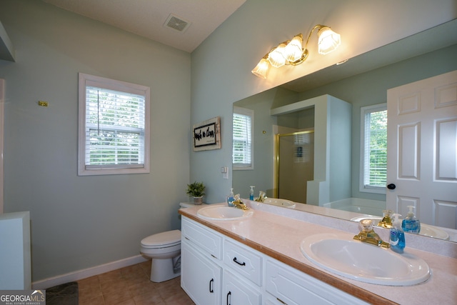 full bath featuring a shower stall, a sink, visible vents, and plenty of natural light