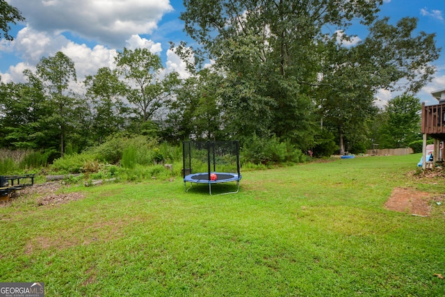 view of yard with a trampoline