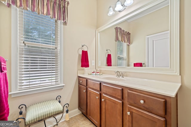 bathroom with tile patterned flooring and vanity