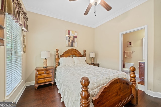 bedroom featuring dark hardwood / wood-style flooring, connected bathroom, multiple windows, and ceiling fan