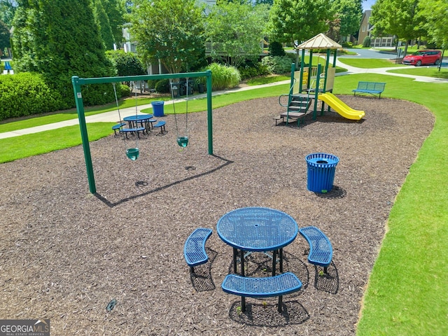 view of jungle gym featuring a lawn