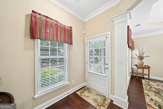 entryway with dark hardwood / wood-style floors, ornate columns, and crown molding