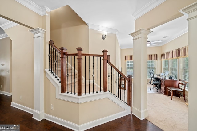 stairs with wood-type flooring, crown molding, and ceiling fan