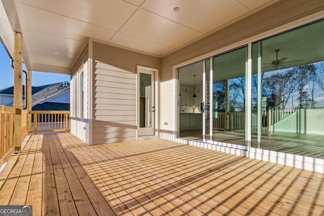 wooden deck with ceiling fan