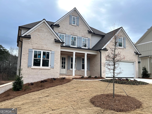 craftsman house with covered porch and a garage