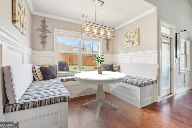 bedroom with multiple windows, a raised ceiling, ceiling fan, and dark wood-type flooring